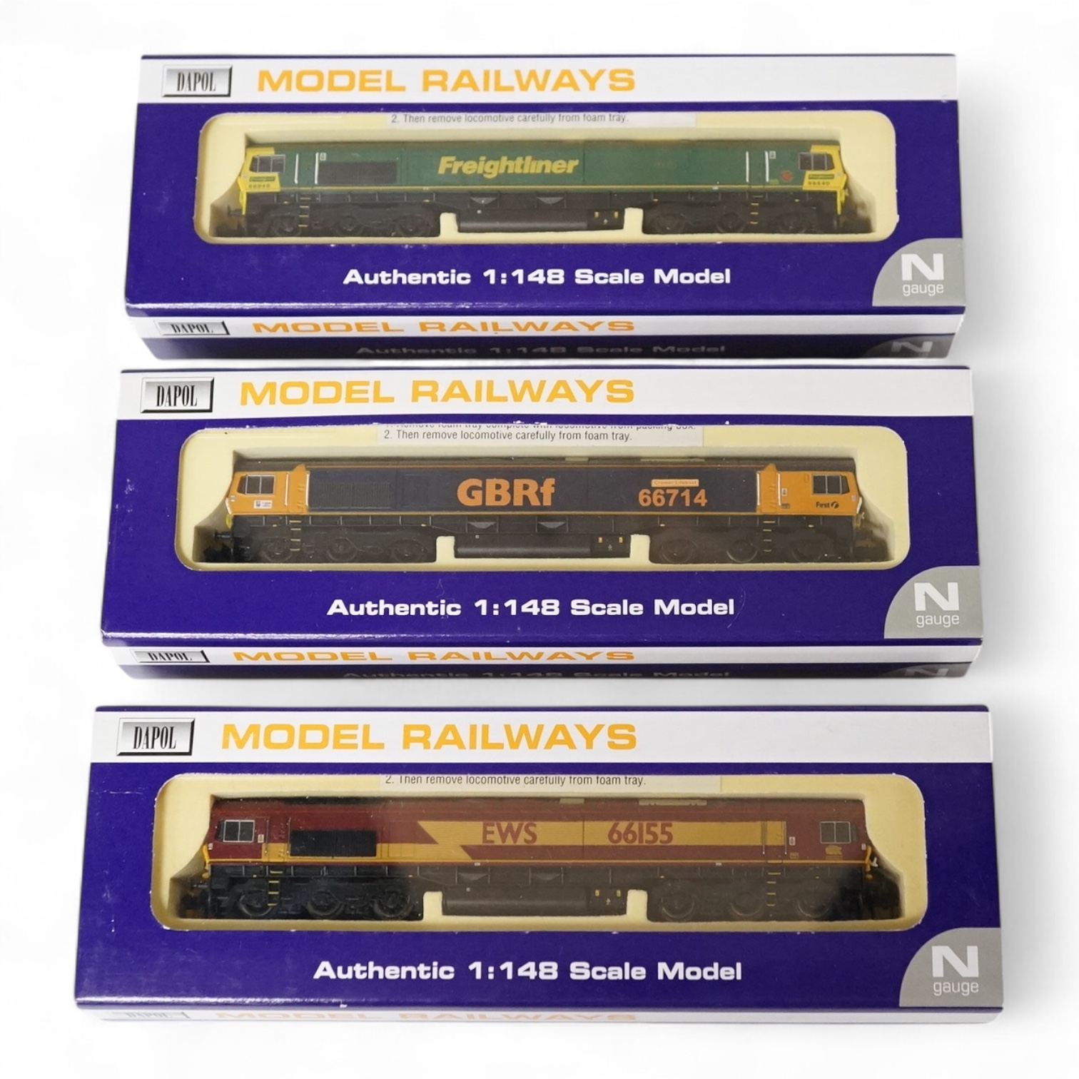 Three boxed Dapol N gauge railway class 66 diesel-electric locomotives; Freightliner 66540 (ND-049), GBRf 66714 (ND-043), and EWS 66155 (ND-032). Condition - good.